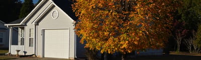 Exterior view of a facility building with autumn foliage