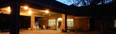 Entrance of assisted living facility with rocking chairs