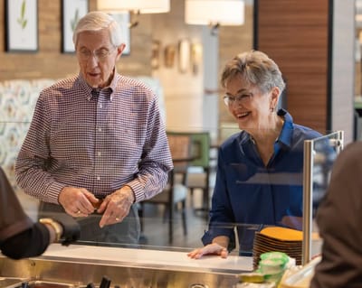 Residents enjoying a meal service in the dining area