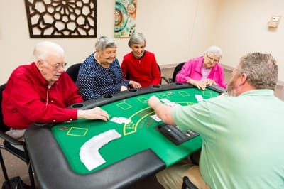 Residents playing cards in a common area