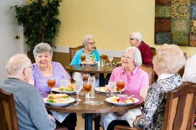 Residents enjoying a meal in the dining room