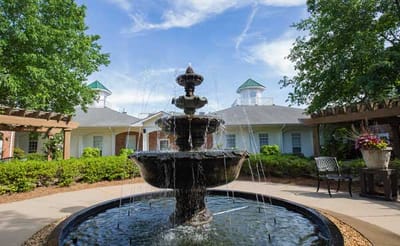 A beautiful fountain surrounded by greenery