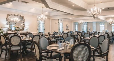 Interior dining room setup with elegant round tables