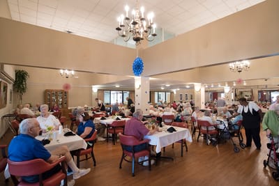 Residents enjoying a meal in the dining area