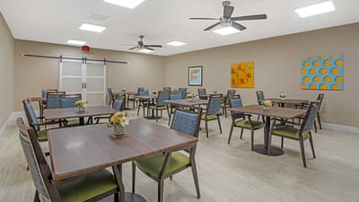 Bright dining room with tables and chairs