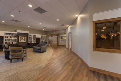 Interior view of a common area with bookshelves and seating