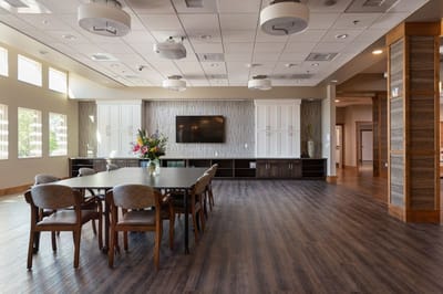 Bright common area with seating and flowers