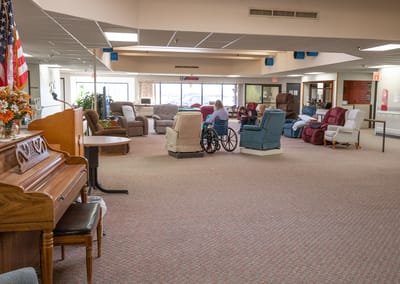 Interior common area with seating and residents