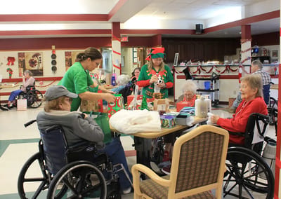Residents and staff engaged in holiday activities
