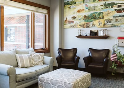 Cozy lounge area with a sofa and chairs