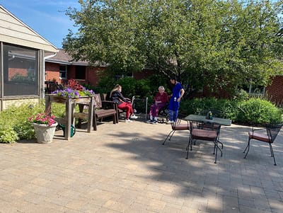 Residents enjoying the outdoor space in a garden area