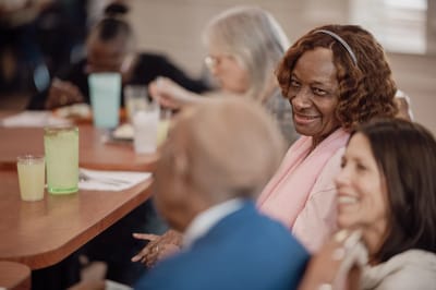 Residents enjoying a meal in a dining area