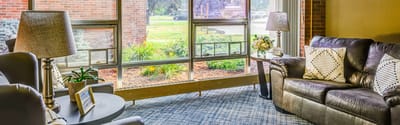Bright common area with seating and natural light