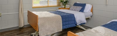 Interior view of a private resident room with beds