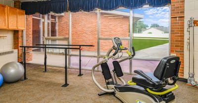Exercise equipment in a bright interior space