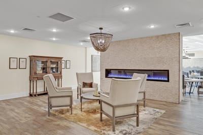 Well-furnished common area with seating and fireplace