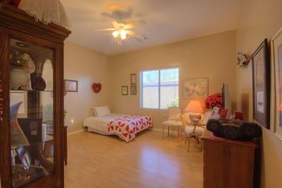 Cozy private room with a bed and seating area