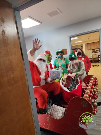 Residents and staff celebrating Christmas in a festive setting