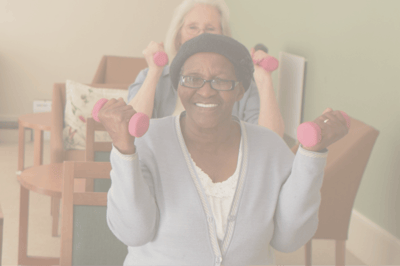 Residents participating in a fitness activity with weights