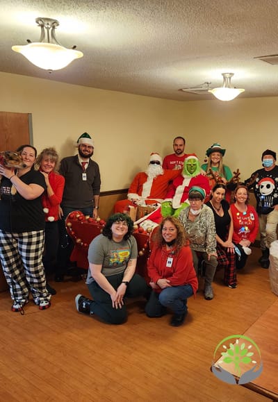 Residents and staff celebrating with holiday costumes