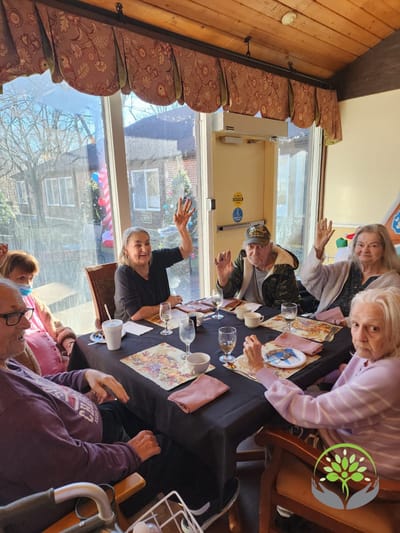 Residents enjoying an activity in a bright common area