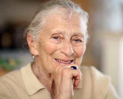 Senior woman smiling warmly at the camera