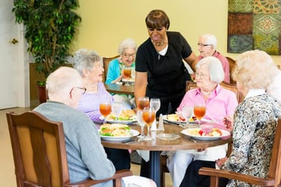 Residents enjoying a meal in the dining room