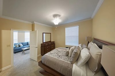 Stylish bedroom with a living area view