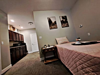 Cozy resident room with kitchenette and decor