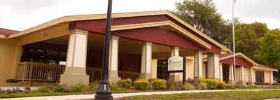 Grace Manor, assisted living in Milwaukee, WI — Senior living facility entrance with landscaped gardens