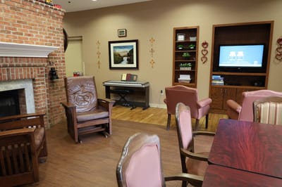 Comfortable common area with seating and a piano
