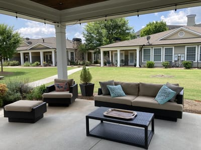 Outdoor seating area with landscaped gardens