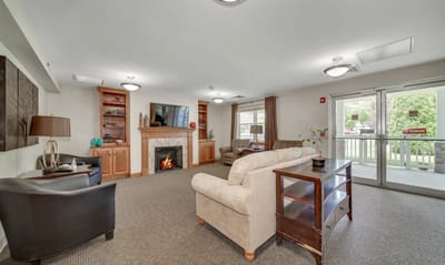 Interior common area with seating and a fireplace