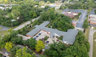 Aerial view of Fair Oaks Health Care Center surrounded by greenery