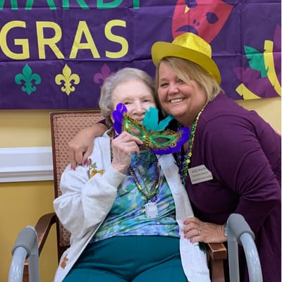 Residents celebrating Mardi Gras with masks and decorations