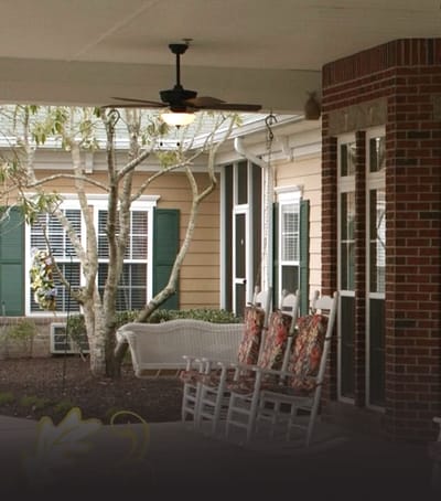 Outdoor porch with rocking chairs and trees