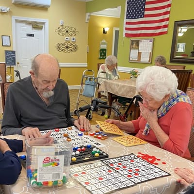Residents playing bingo in a common area