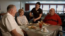 The Lexington, independent living in Johnson City, TN — Seniors enjoying a meal served by staff members