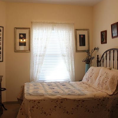 A cozy private resident room with soft lighting