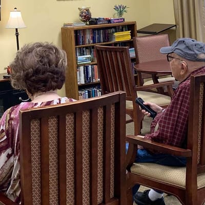 Two residents seated in a common area