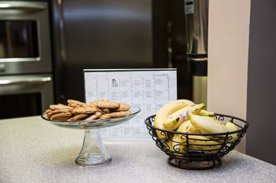 Cookies and bananas displayed on a counter