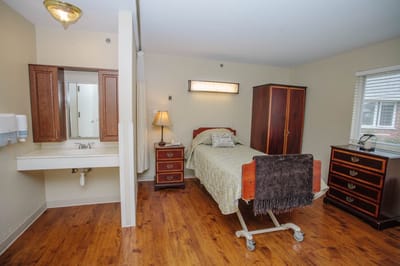 Private resident room with bed and furnishings