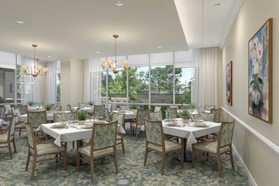 Bright dining room with tables set for meals