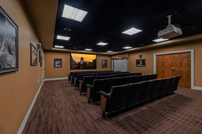 Interior view of a small theater room with seating