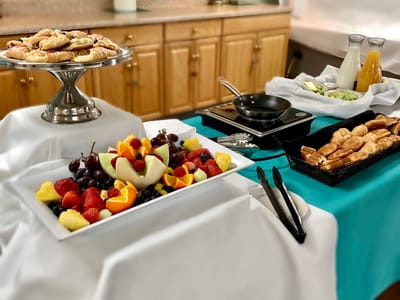 A beautifully arranged fruit and pastry display in the dining area