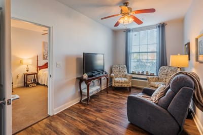 Cozy interior of a resident room with comfortable seating