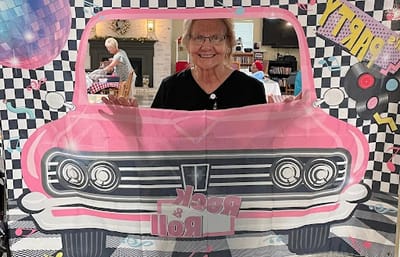 Resident enjoying a themed photo booth activity