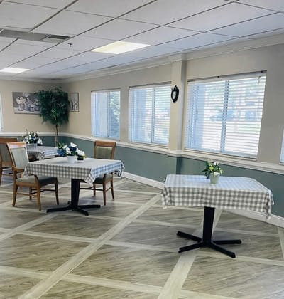 Dining area with checkered tablecloths and flowers