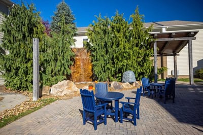 Outdoor seating area with a waterfall feature