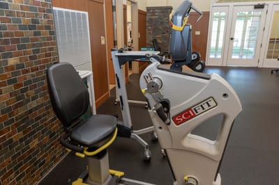 Fitness equipment in a well-lit rehabilitation area